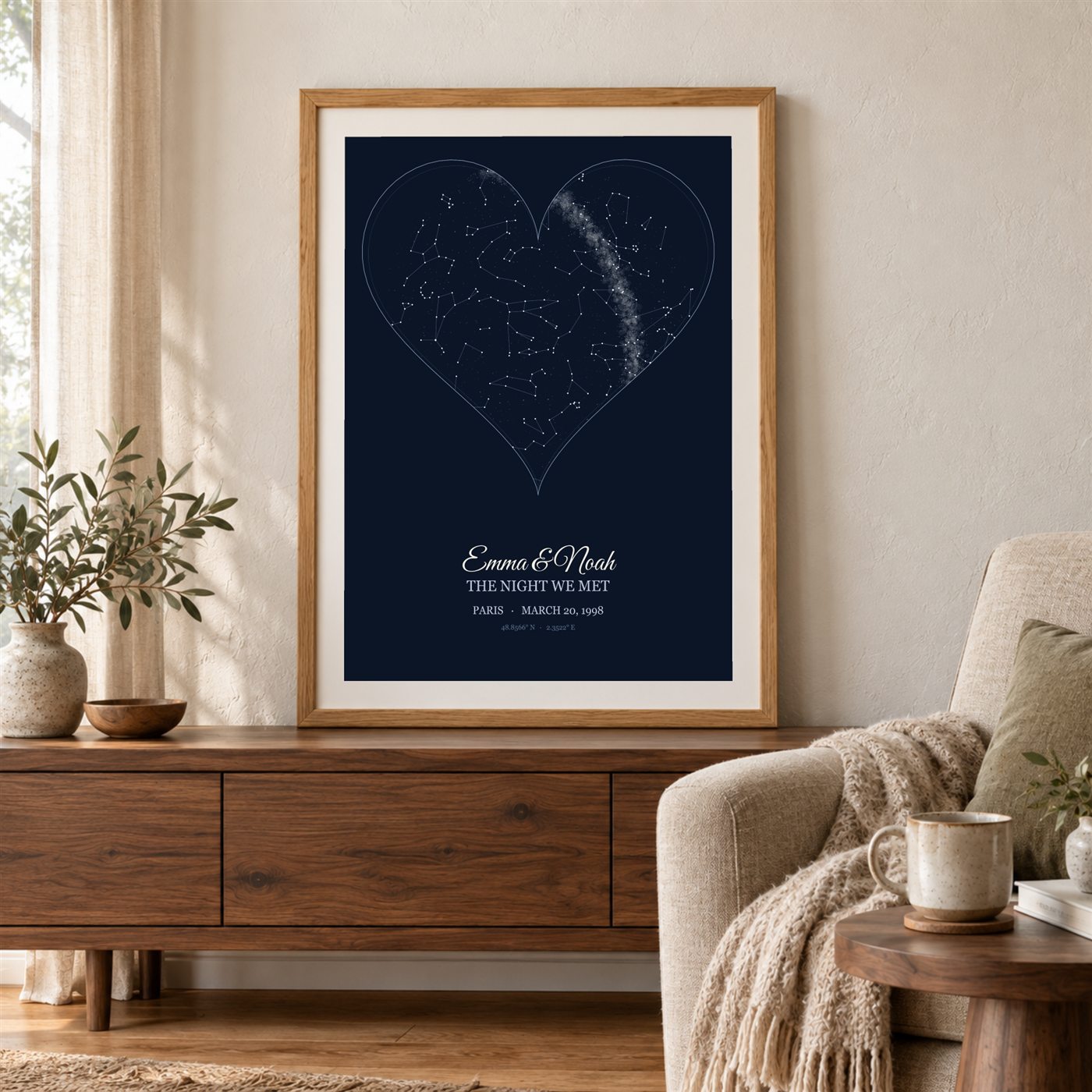 A heart-shaped navy star map, framed in oak above a sideboard